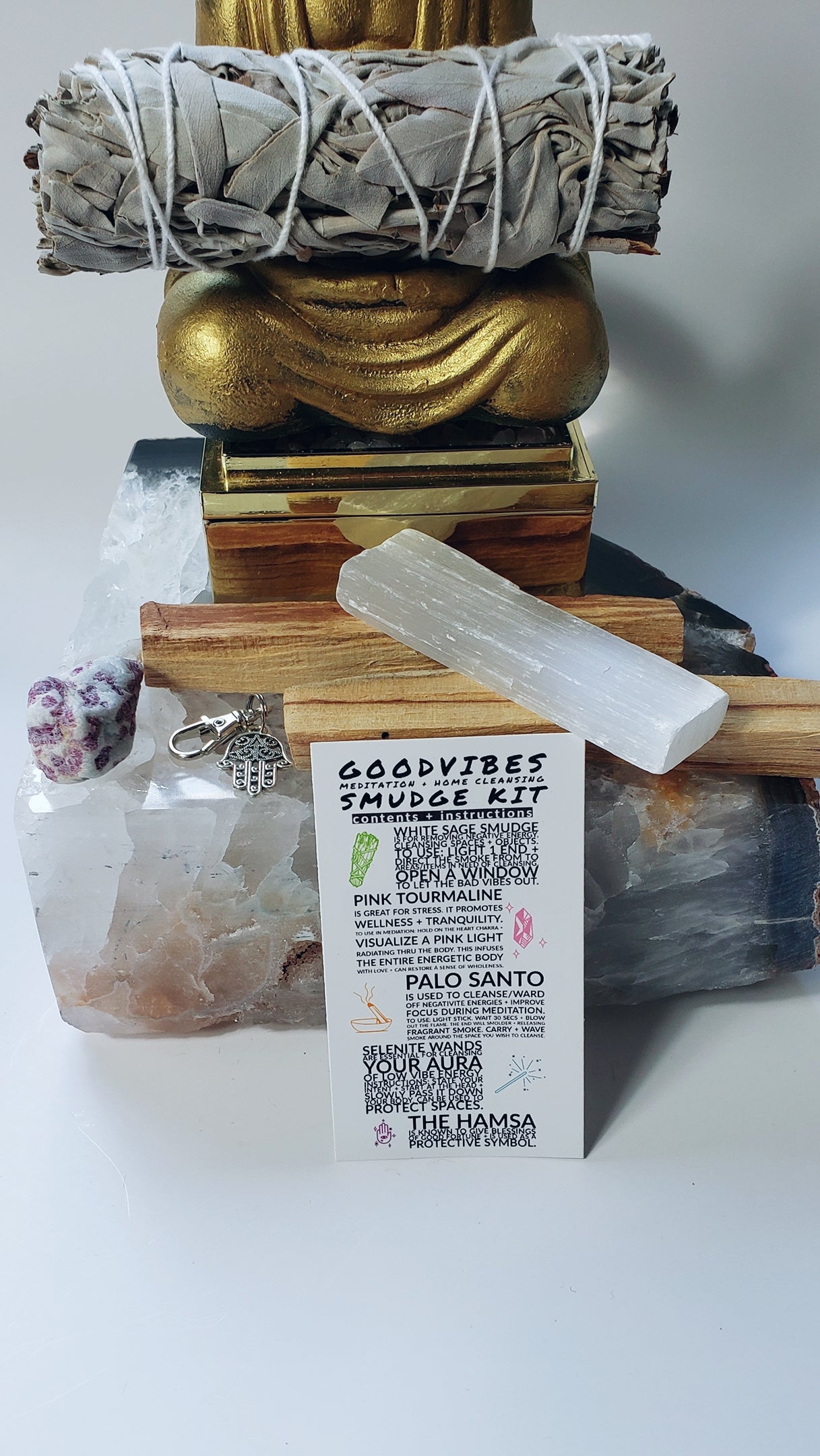 Pure light energy is added with the raw selenite wand and a pink tourmaline stone. 
