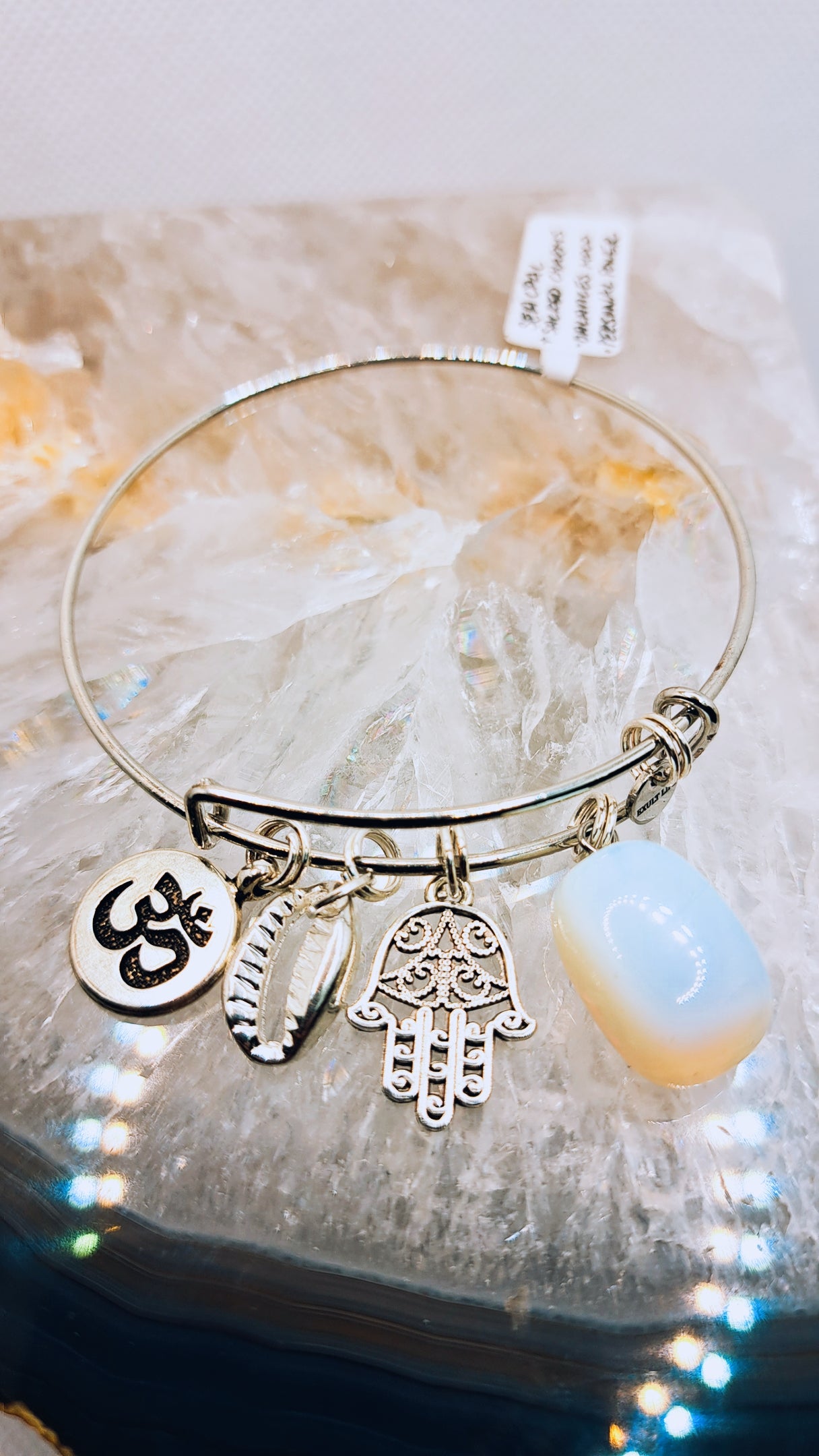 Sacred symbol charms added to enhance the bracelets meaning and energetic potential.